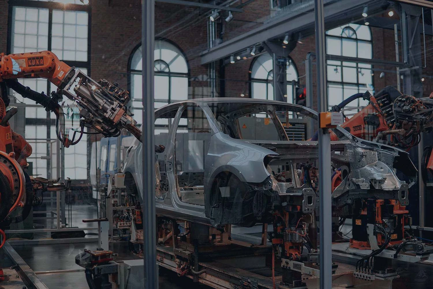 vehicle manufacturing plant with robotic arms